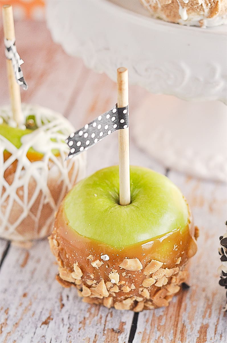 caramel apple with  nuts on it