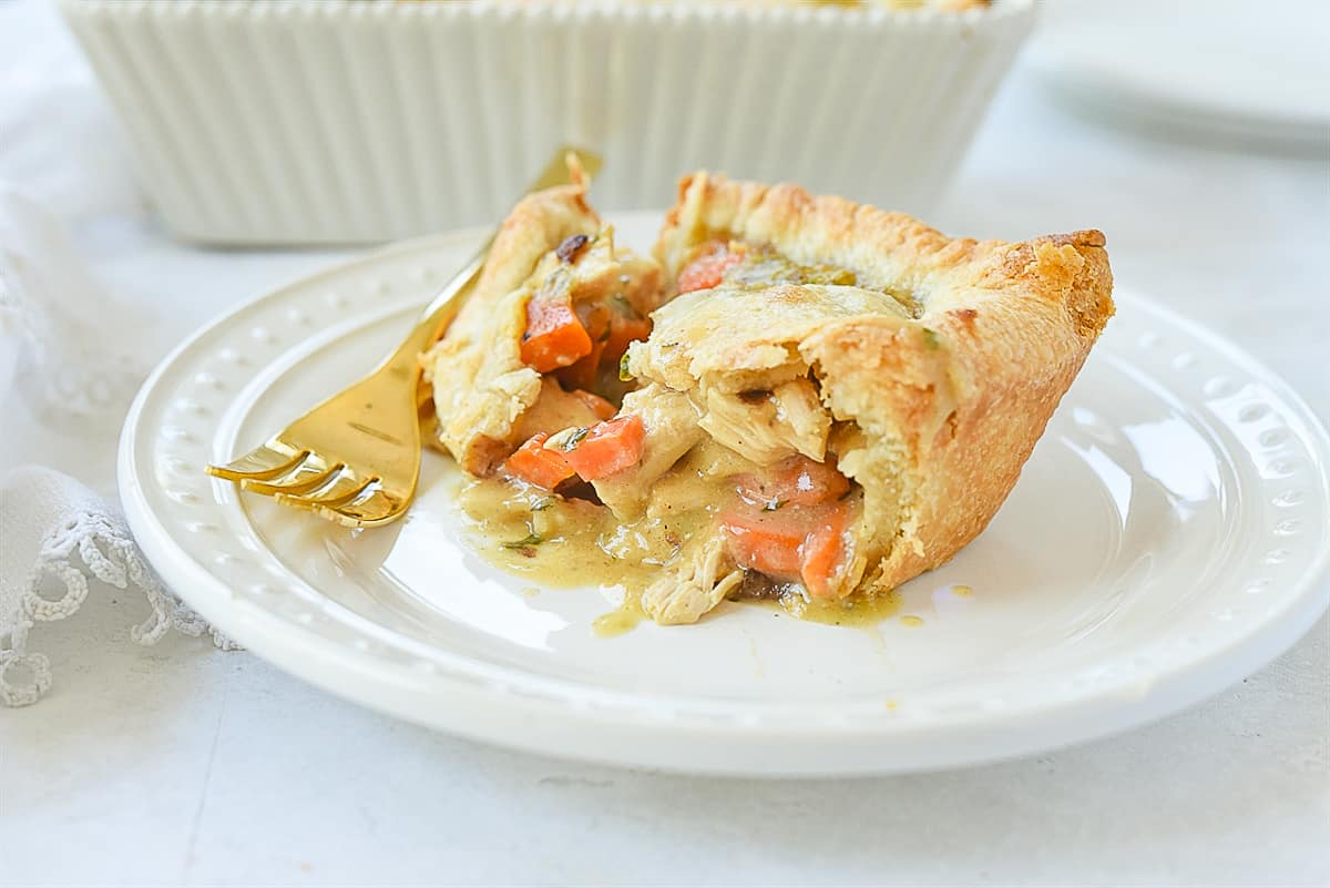 piece of chicken pot pie on a plate.