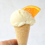 creamsicle ice cream in a hand