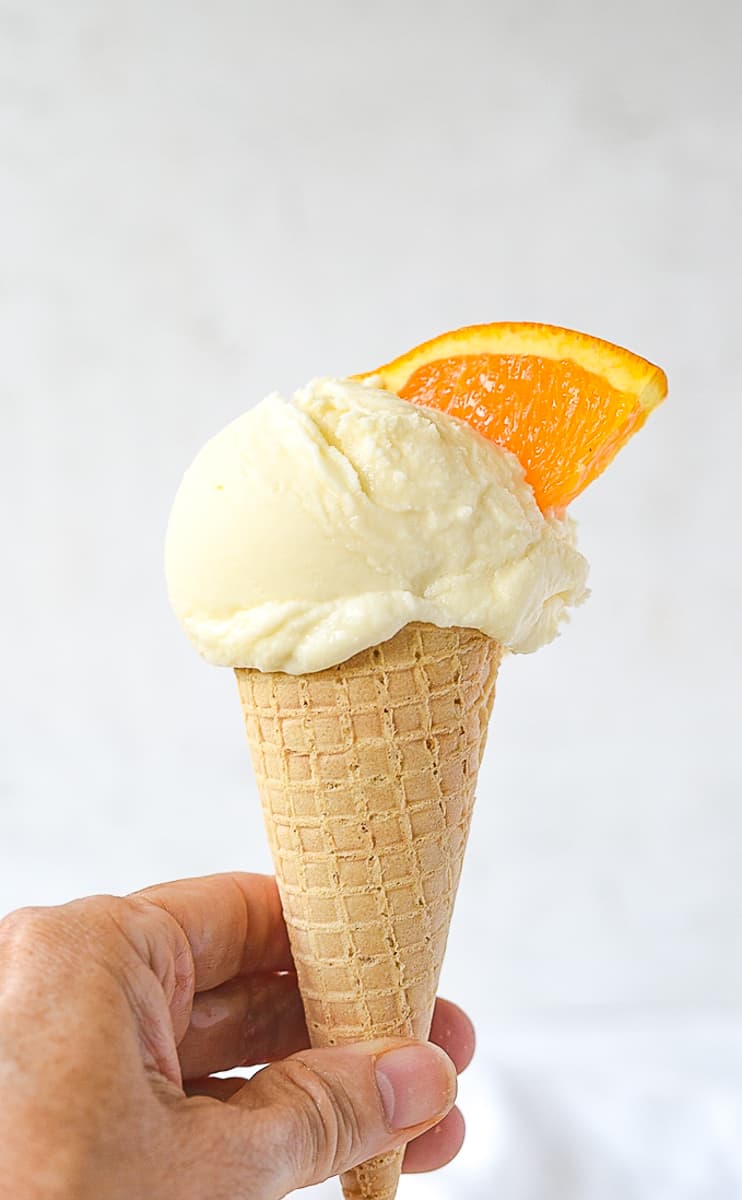 creamsicle ice cream in a hand