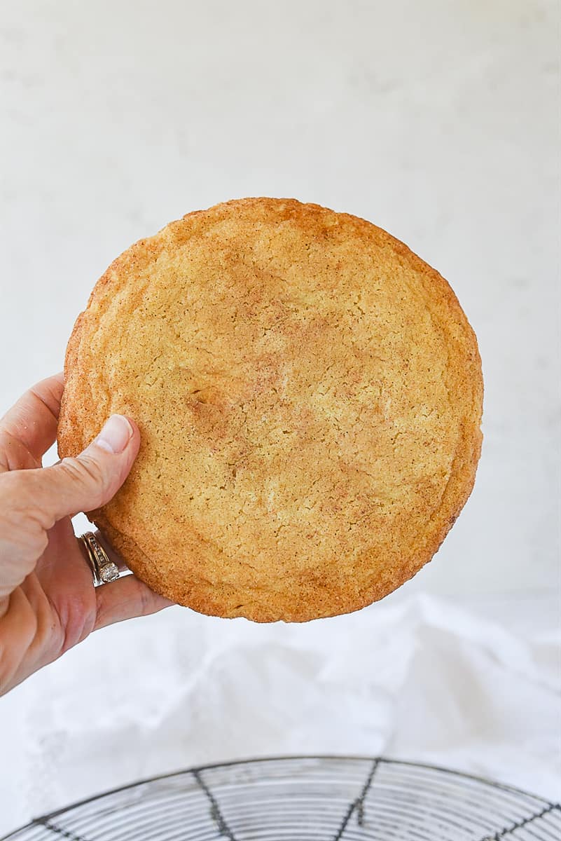 giant snickerdoodle cookie recipe hand holding giant snickerdoodle