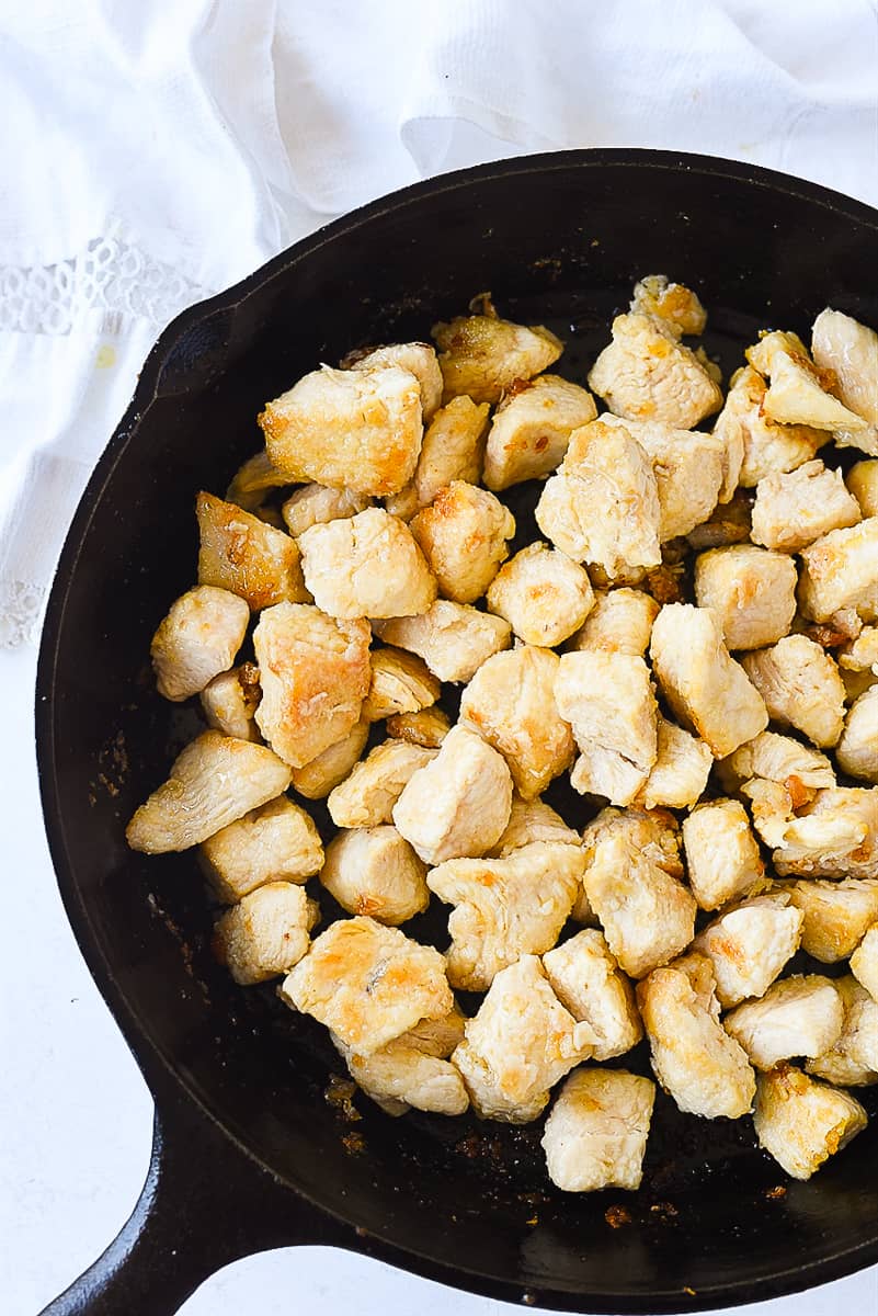 cooked chicken in a cast iron pan