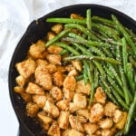 stirfry chicken and green beans in pan