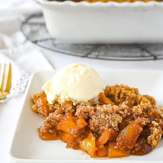 plate of mango crumble with ice cream