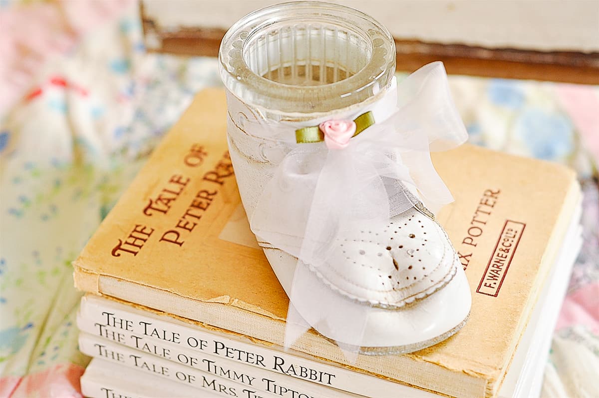 baby shoe on books