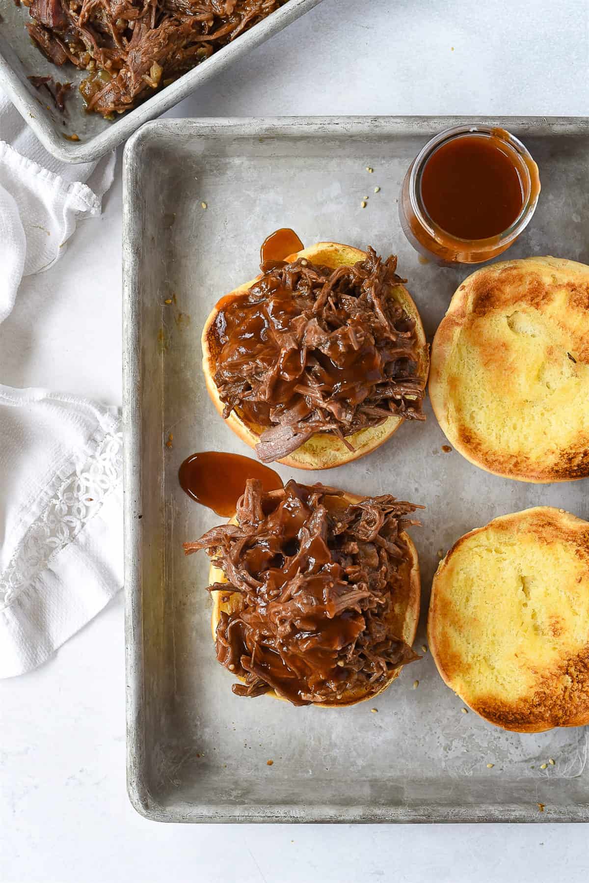 overhead view of assembling bbq beef sandwiches