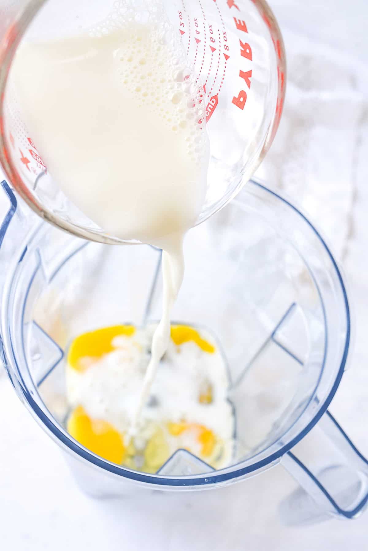 pouring milk into blender