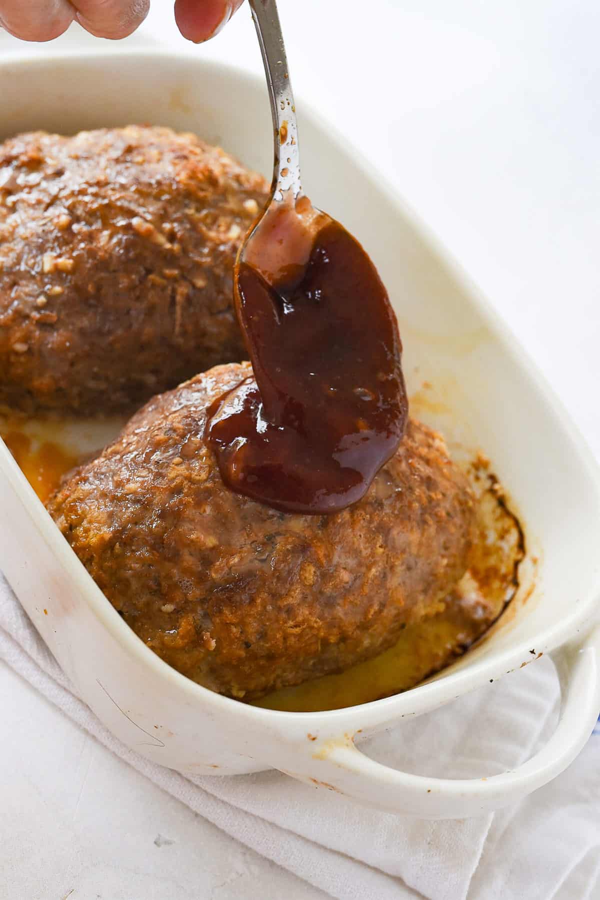 glazing the meatloaf with ketchup mixture