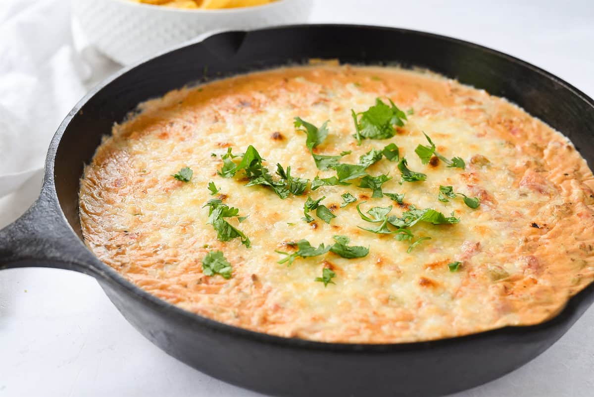 cast iron skillet of chili con queso dip