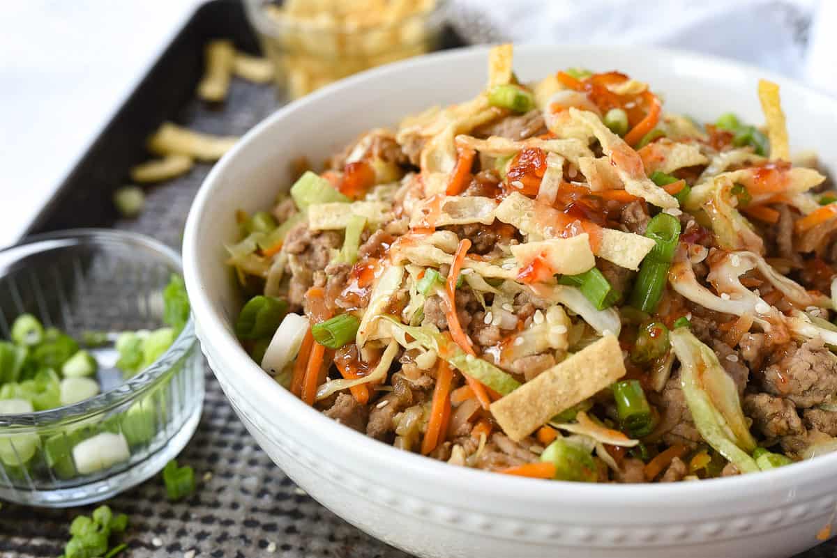 eggroll in a bowl with won ton strips on top