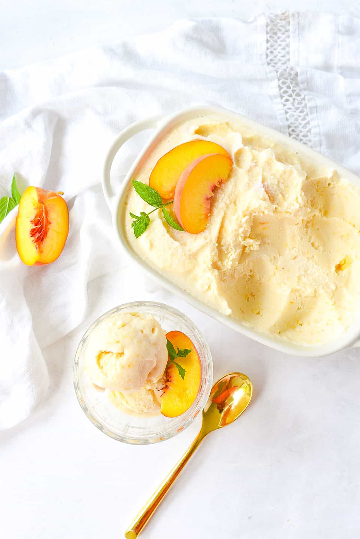 dish of peach ice cream and a spoon