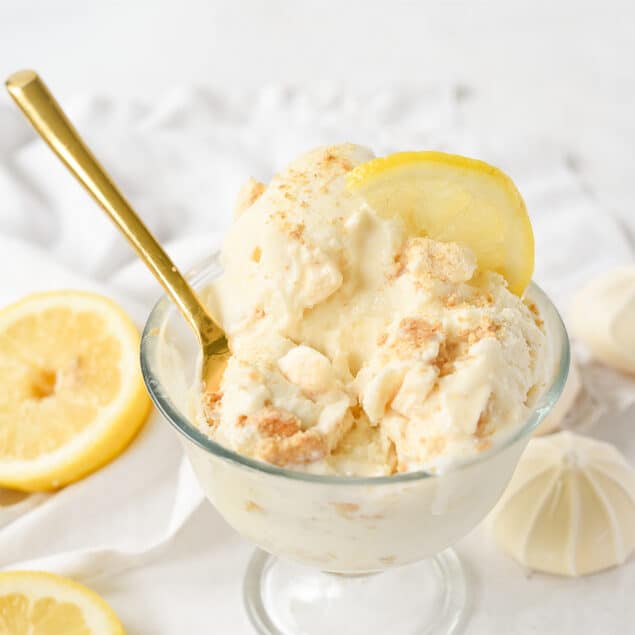 spoon in a bowl of lemon meringue ice cream