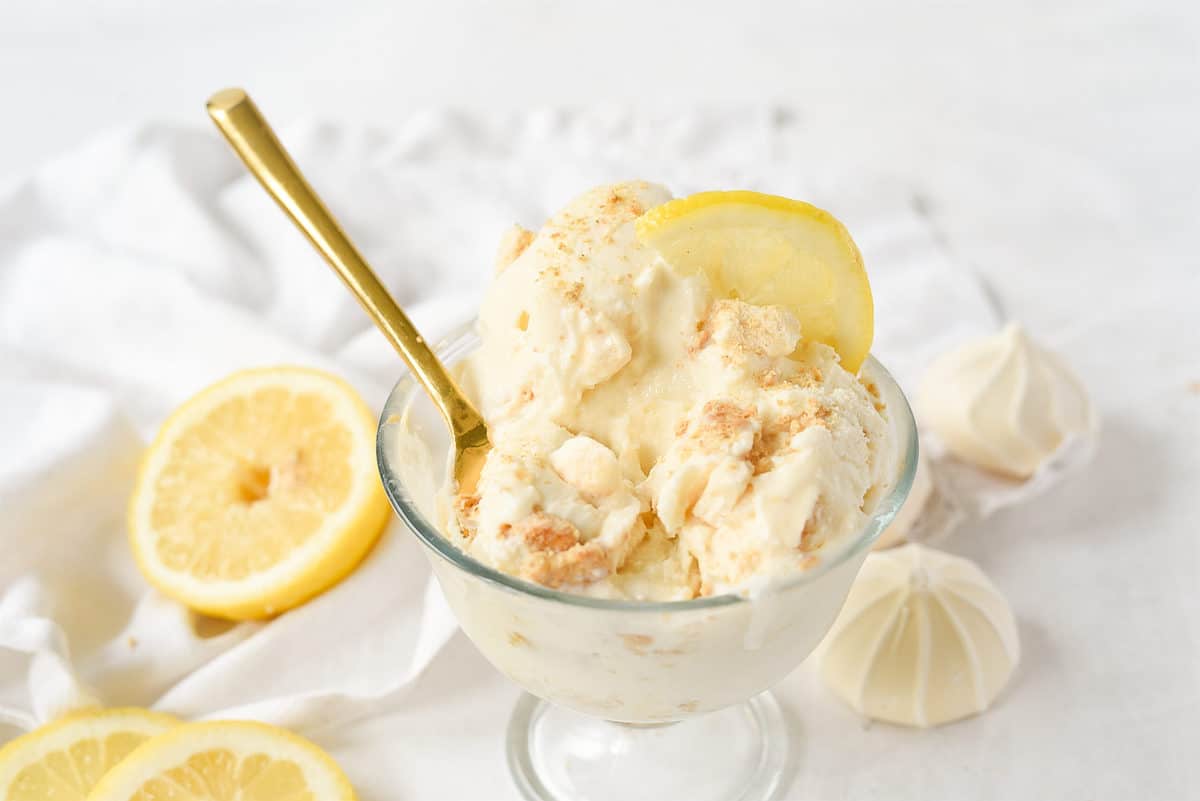 spoon in a bowl of lemon meringue ice cream