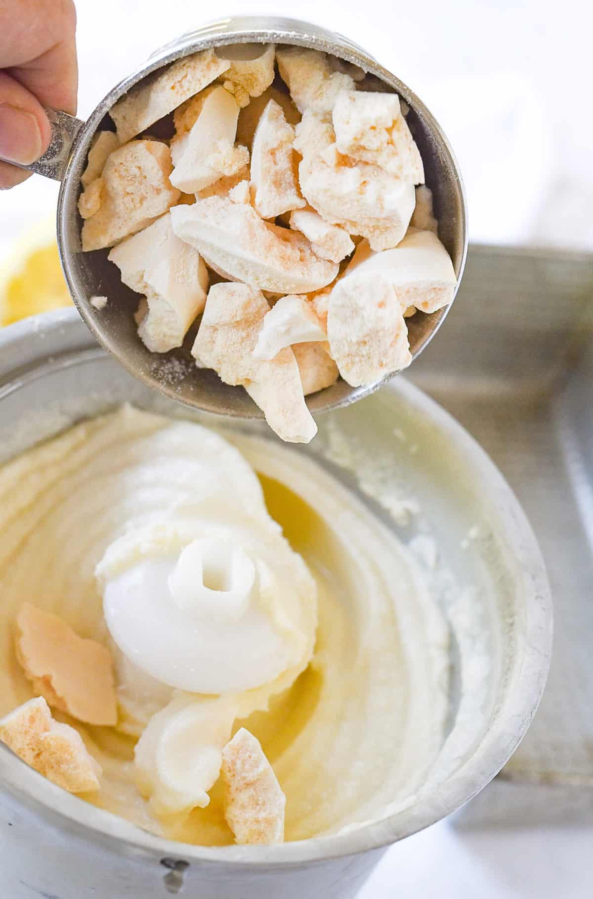 adding meringue cookies ice cream