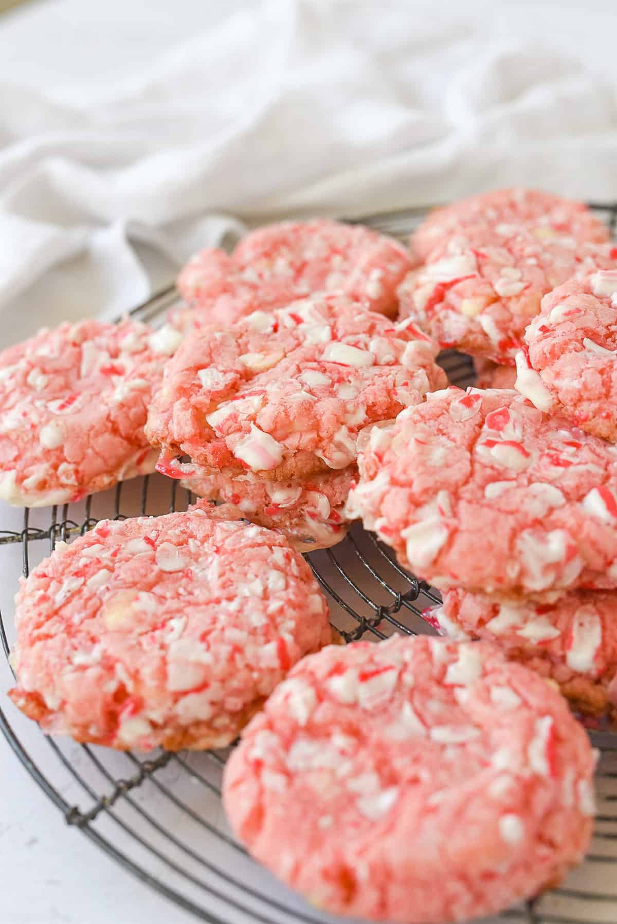 stacks of peppermint cookies on a cooling rack