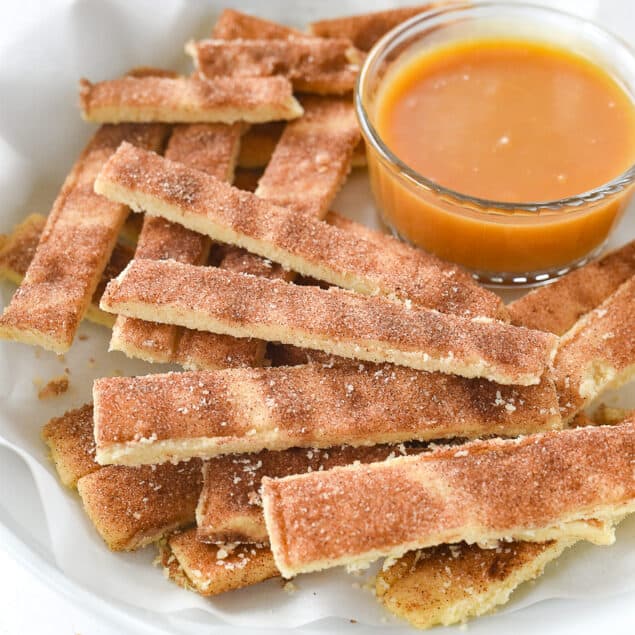 pie fries with caramel dipping sauce in a bowl