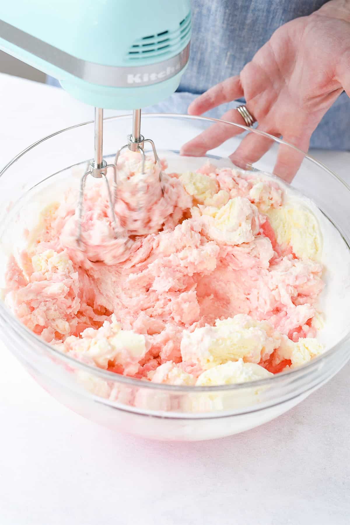 mixing ice cream and lemonade together in a bowl