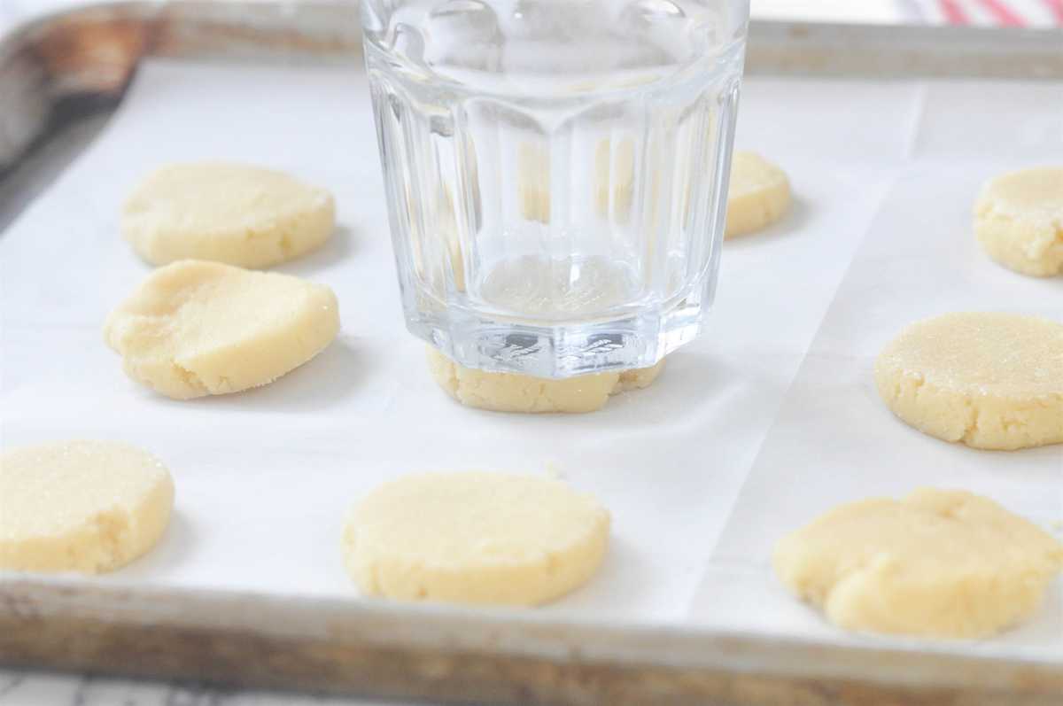 glass pushing down sugar cookies