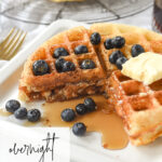 stack of two overnight yeast waffles with syrup