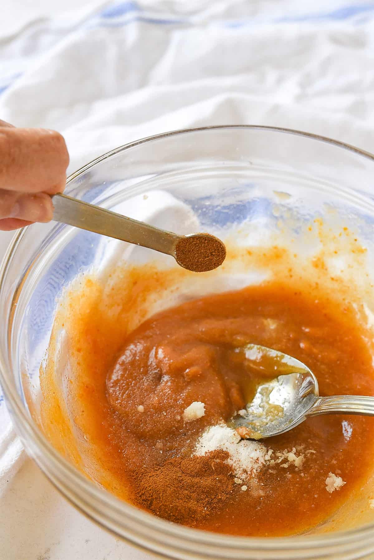 adding cinnamon to pumpkin cookies