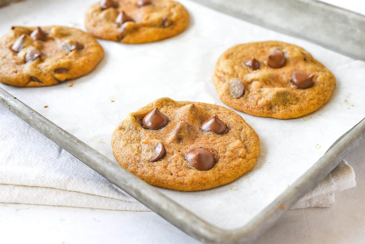 pumpkin cookies on a baking sheet