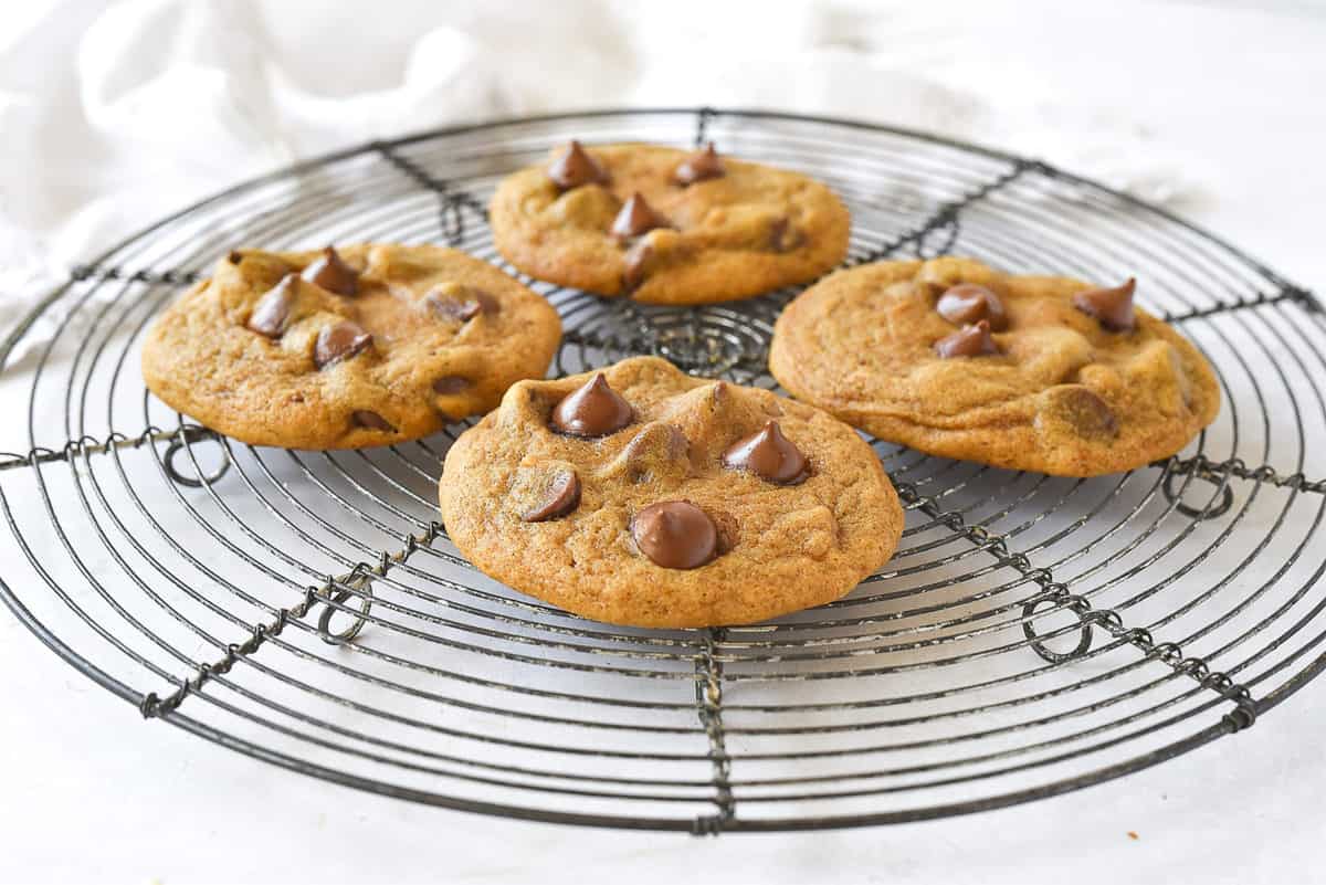 four pumpkin cookies with chocolate chips