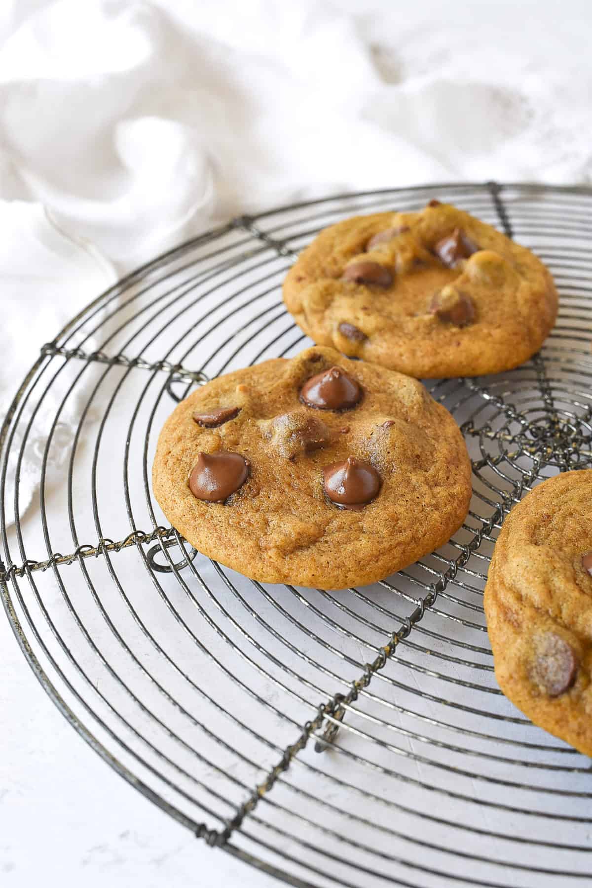 chocolate chip pumpkin cookies on cooling rack