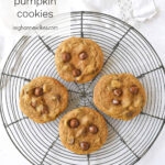 four pumpkin cookies on a cooling rack