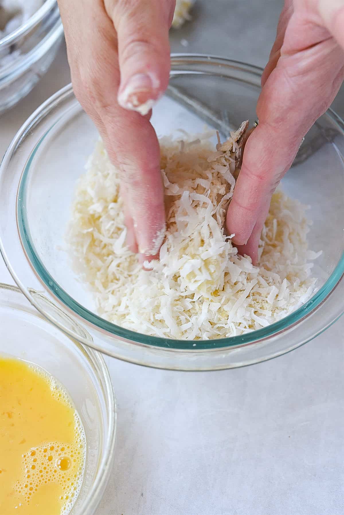 dipping shrimp in coconut