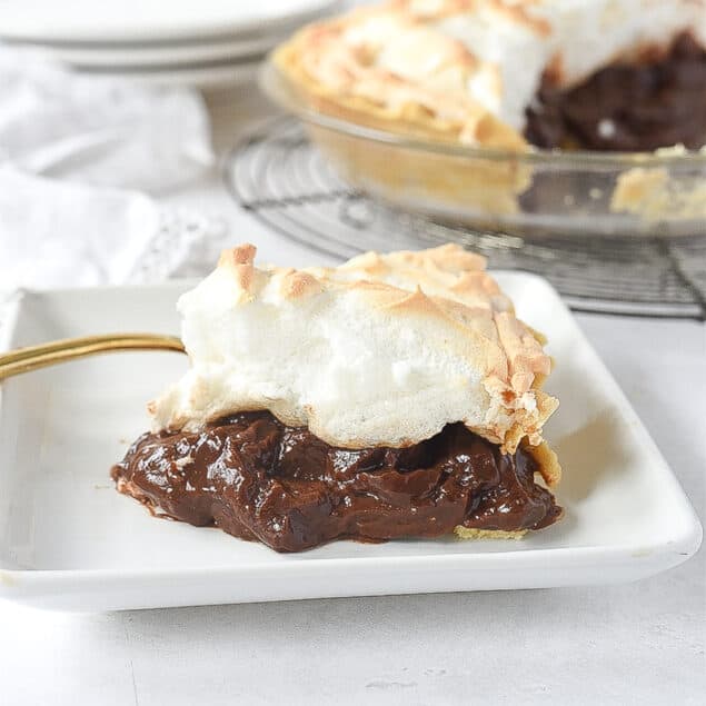 slice of chocolate meringue pie on a plate