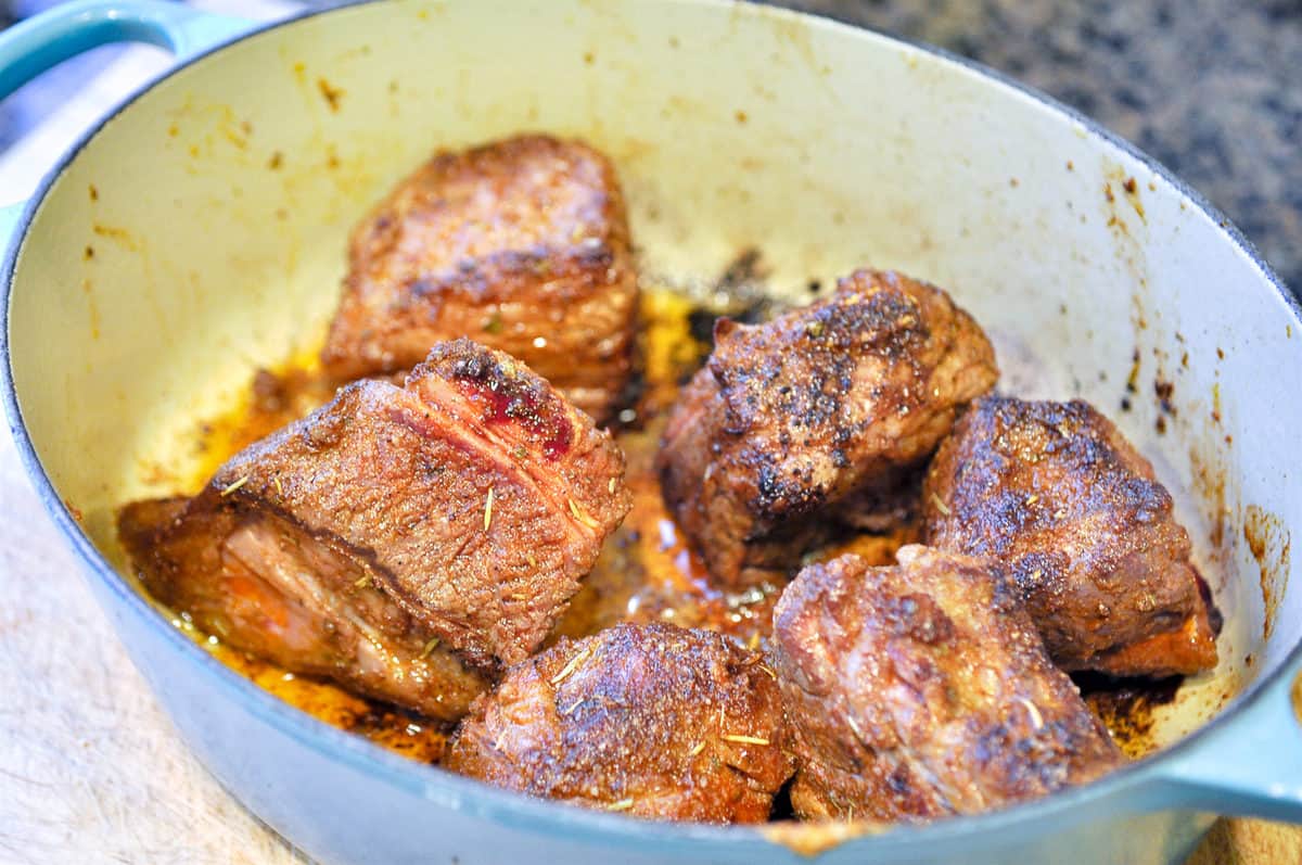 browning short ribs in a pot