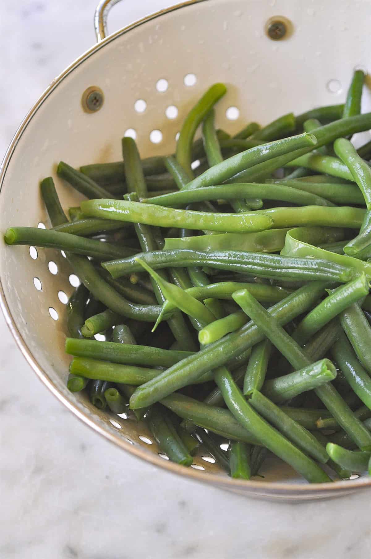 colander of blanched green beans