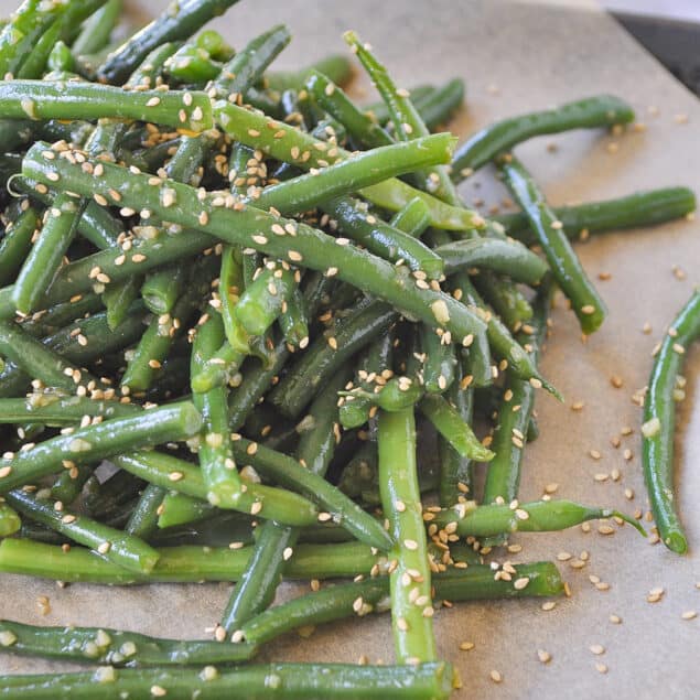 pile of green beans on parchment paper