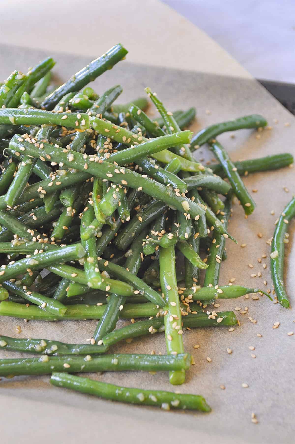 pile of green beans  on parchment paper