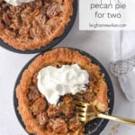 two small pecan pies with whipped cream