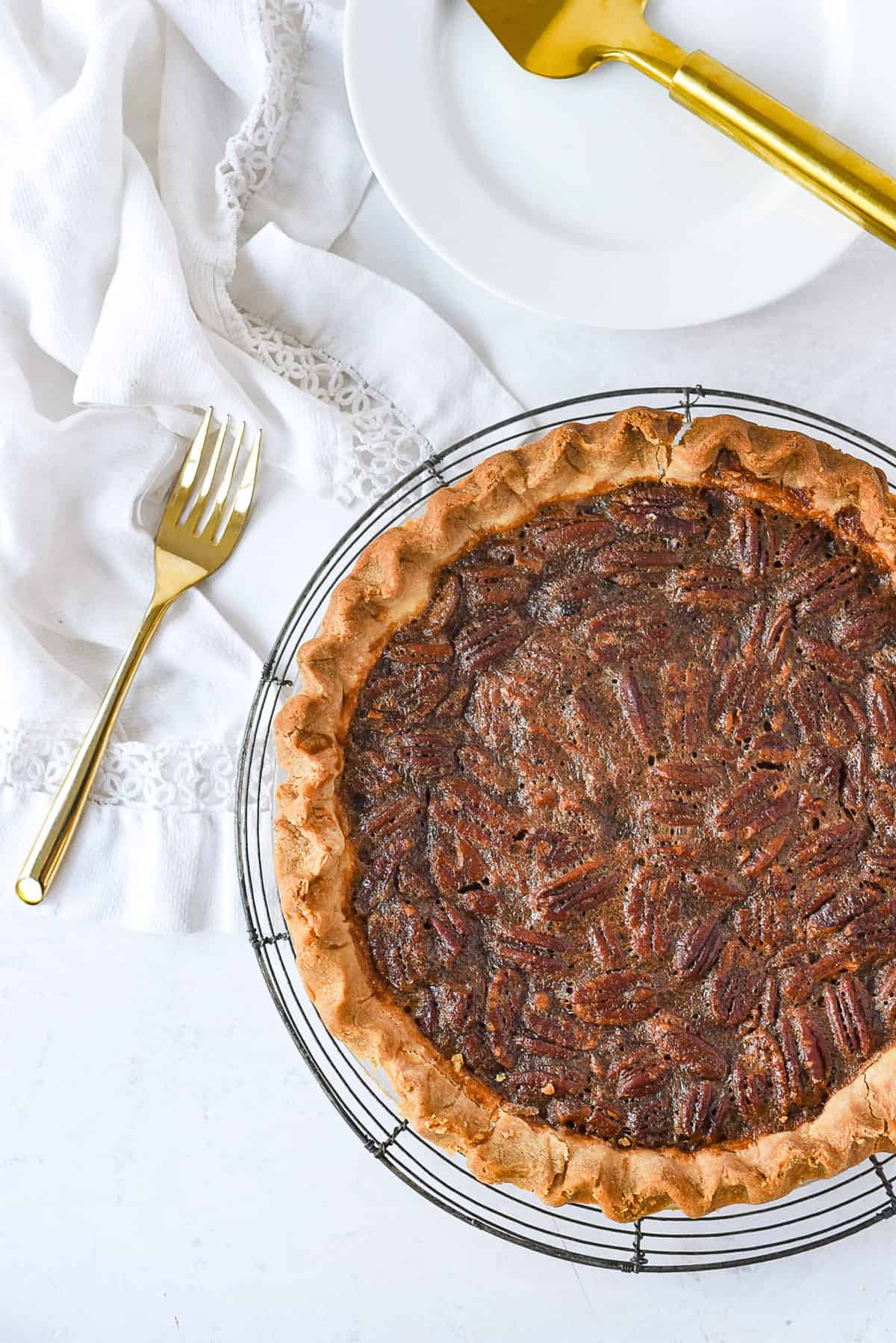 whole pecan pie and a fork