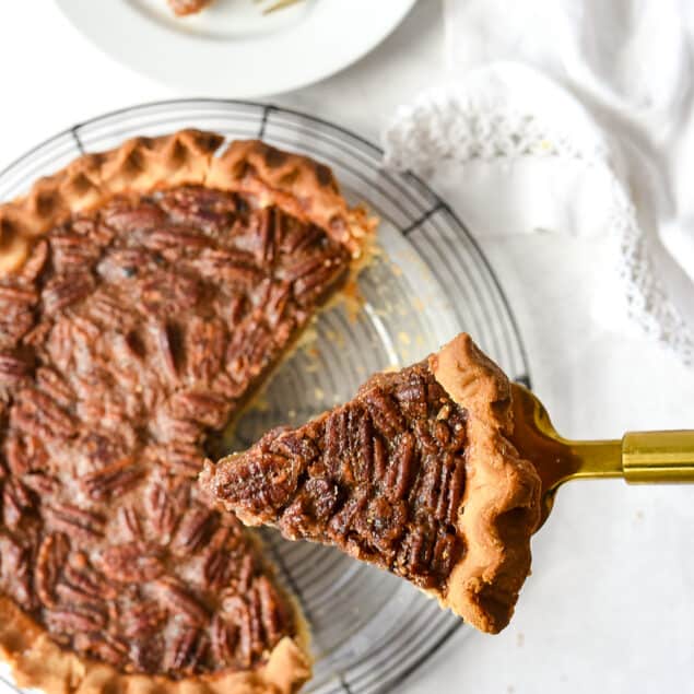 slice of pecan pie on a spatula