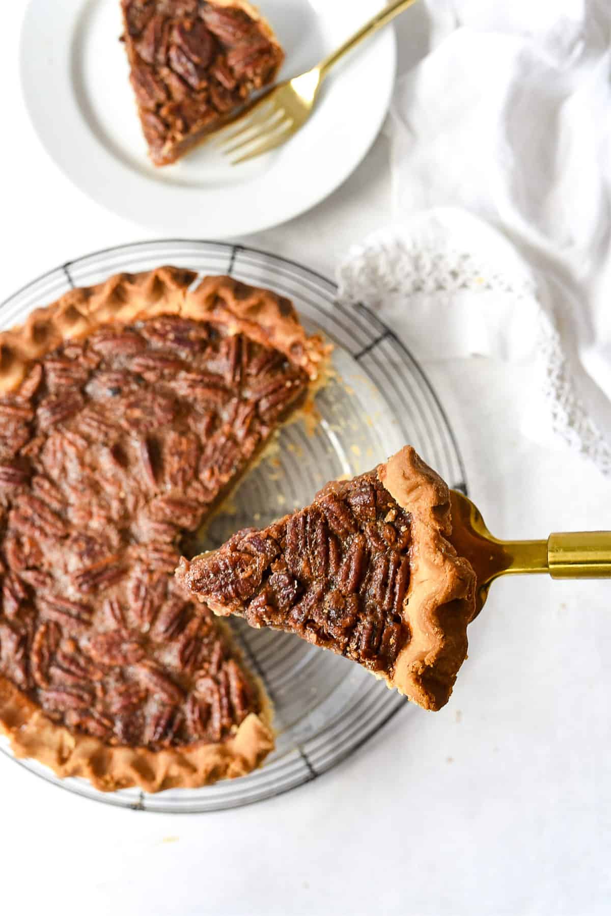 slice of pecan pie on a spatula