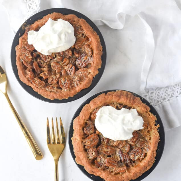 overhead shot of two small pecan piees