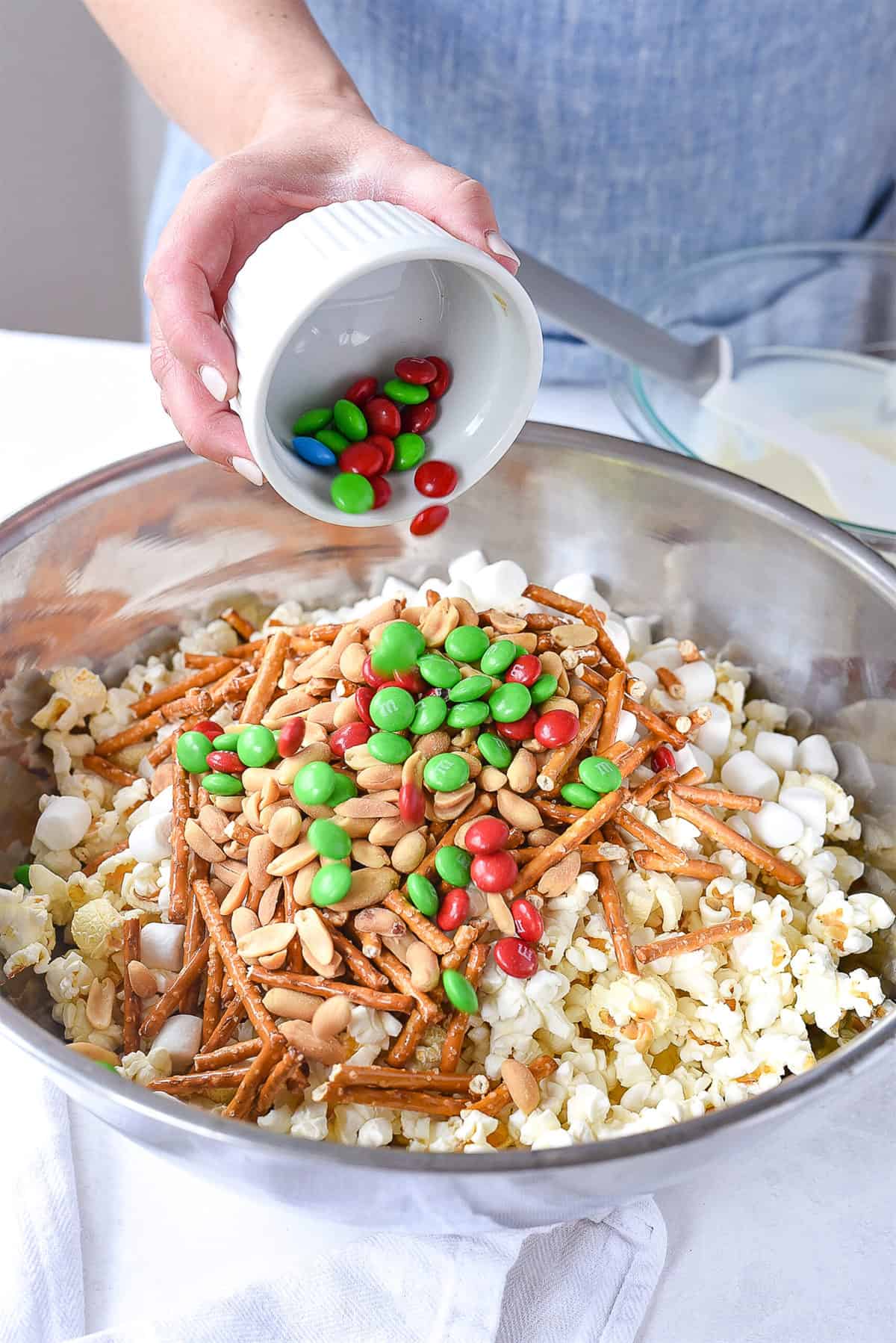 adding M & M's into popcorn