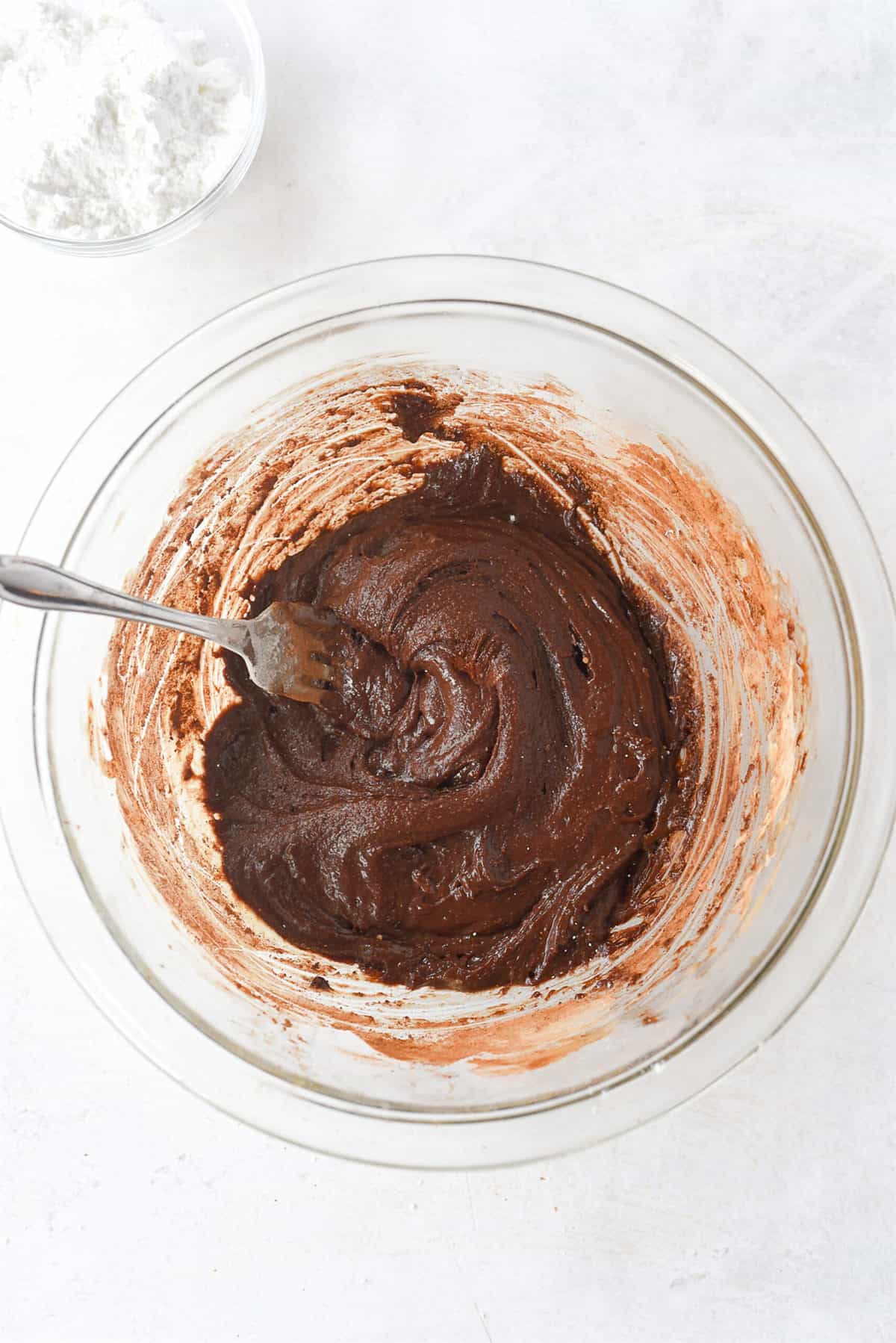 chocolate crinkle cookie dough in a bowl.