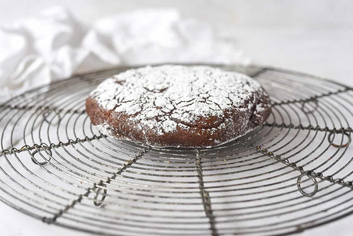 chocolate crinkle cookie on a cooling rack