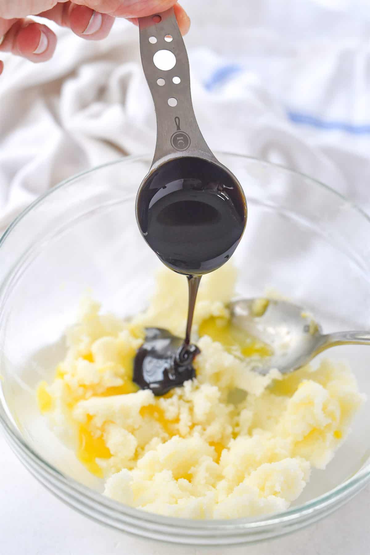 adding molasses to cookie dough