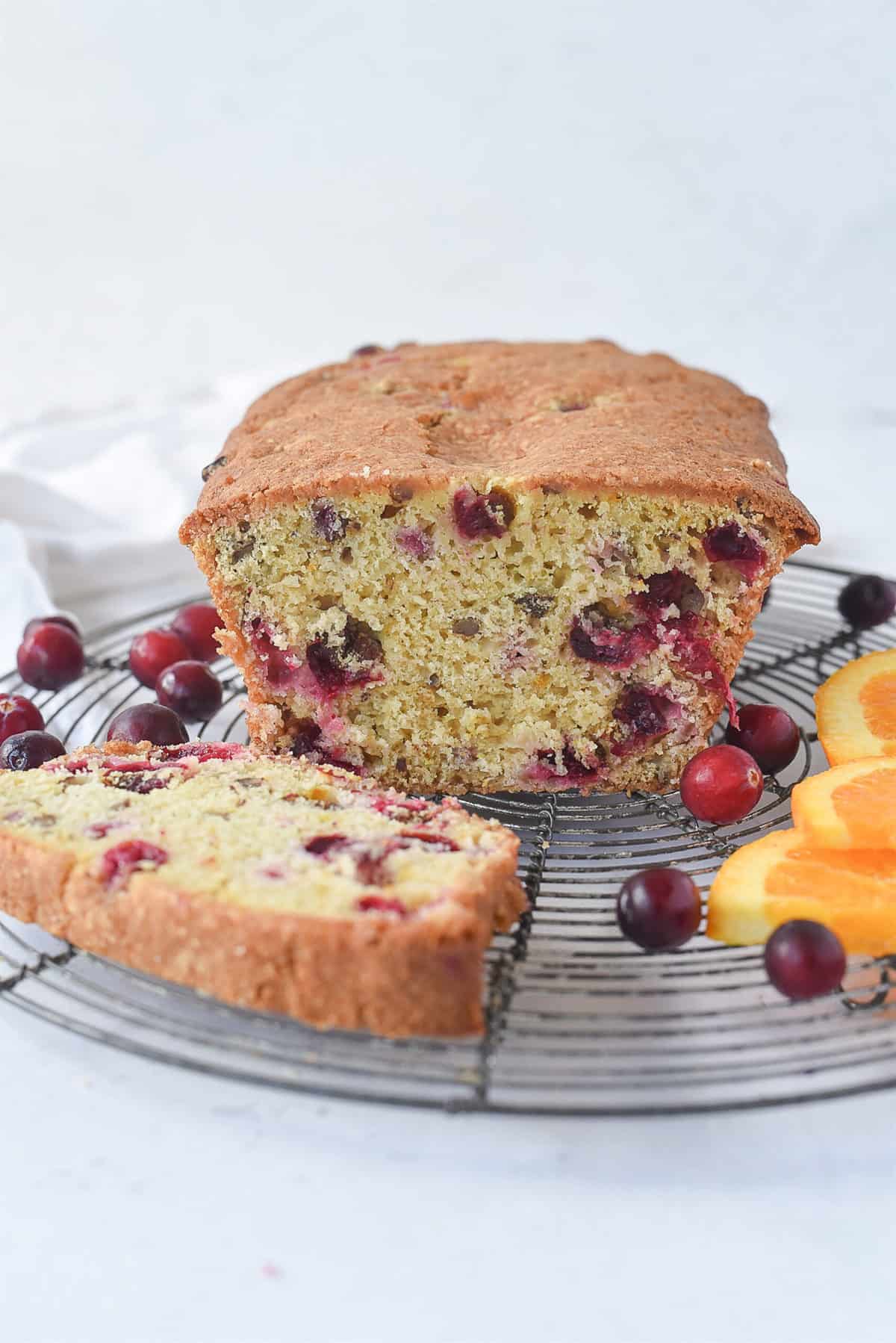 loaf of cranberry bread on a cooling rack