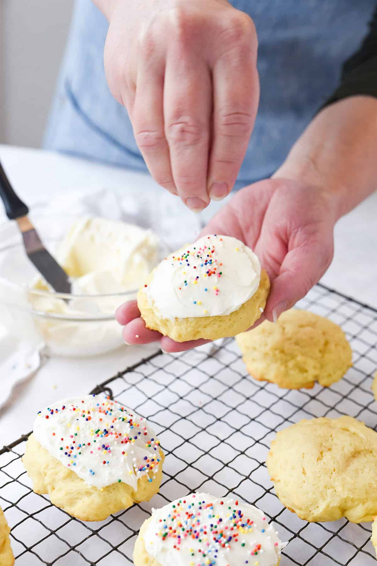 adding sprinkles to sugar cookies