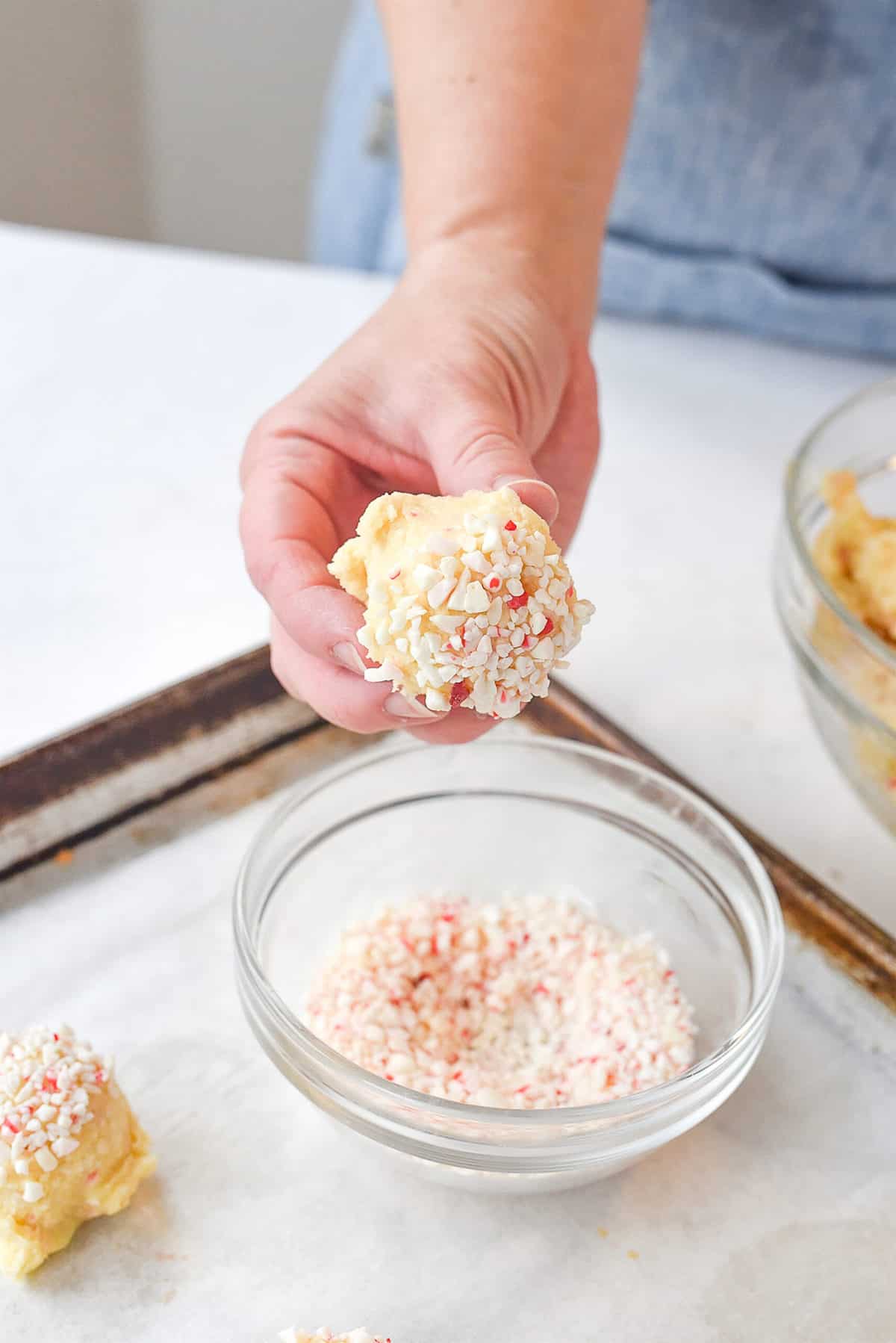 dipping cookie dough into peppermint