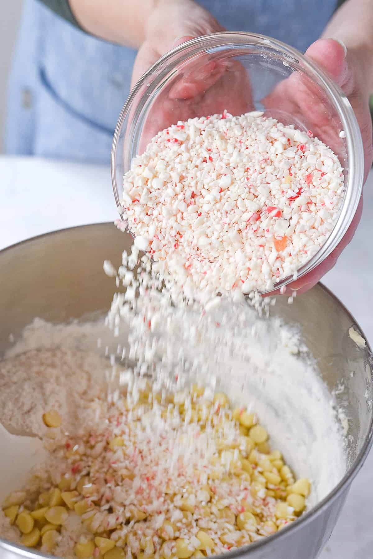 adding crushed peppermint to cookies