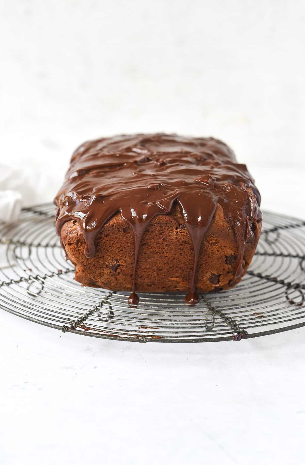 loaf of chocolate cinnamon bread on a cooling rack