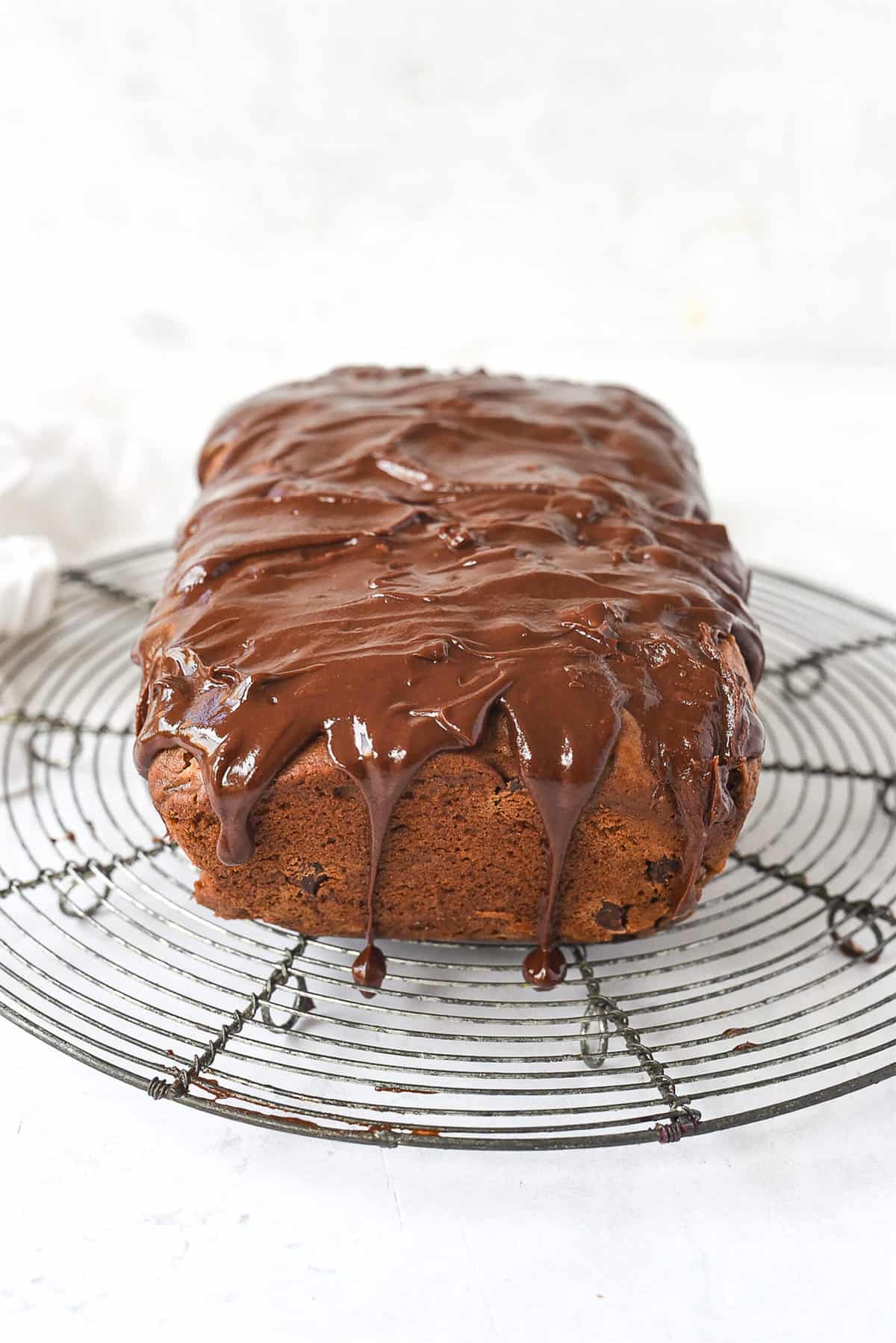 loaf of chocolate chip cinnamon bread on cooling rack