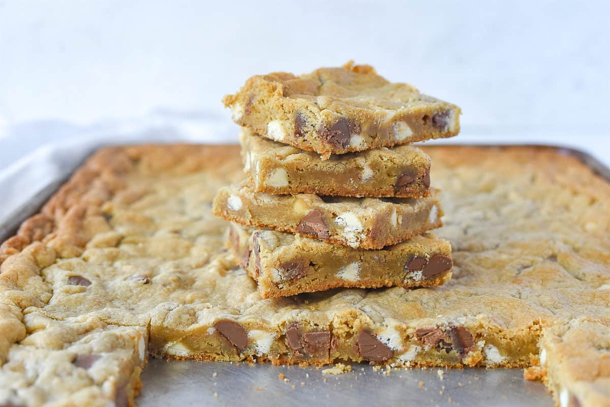 stack of chocolate chip cookie bars on pan